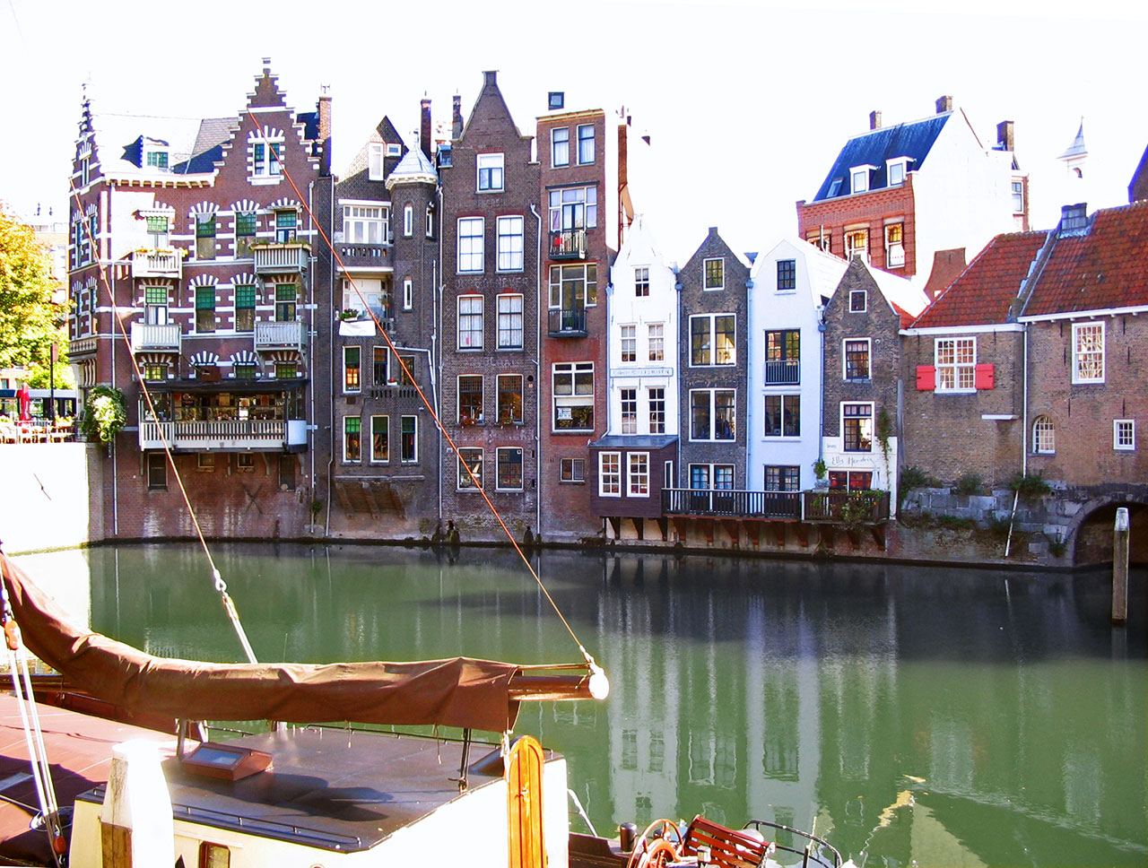 Many styles of boats line the Aelbrechtskolk Canal in Delftshaven, Rotterdam, The Netherlands.